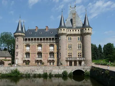 The Château de La Clayette beside its lake