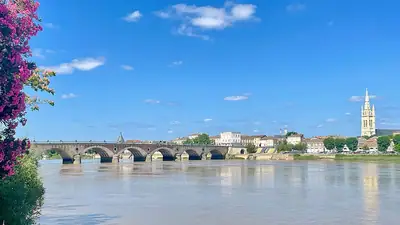 The stone bridge and church tower of Libourne
