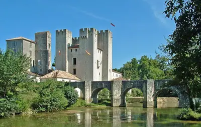 The fortified mill of Barbaste beside its bridge